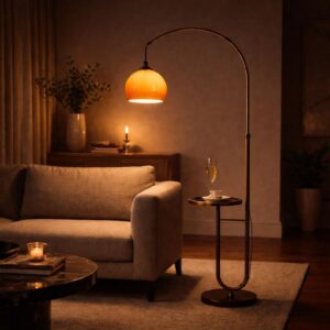 Arc floor lamp with side table beside sofa and warm orange shade