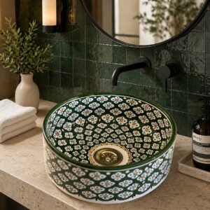 Green floral ceramic vessel sink installed on luxury bathroom vanity