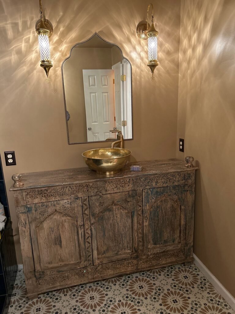 Handmade hammered copper sink with warm patina and artisan texture